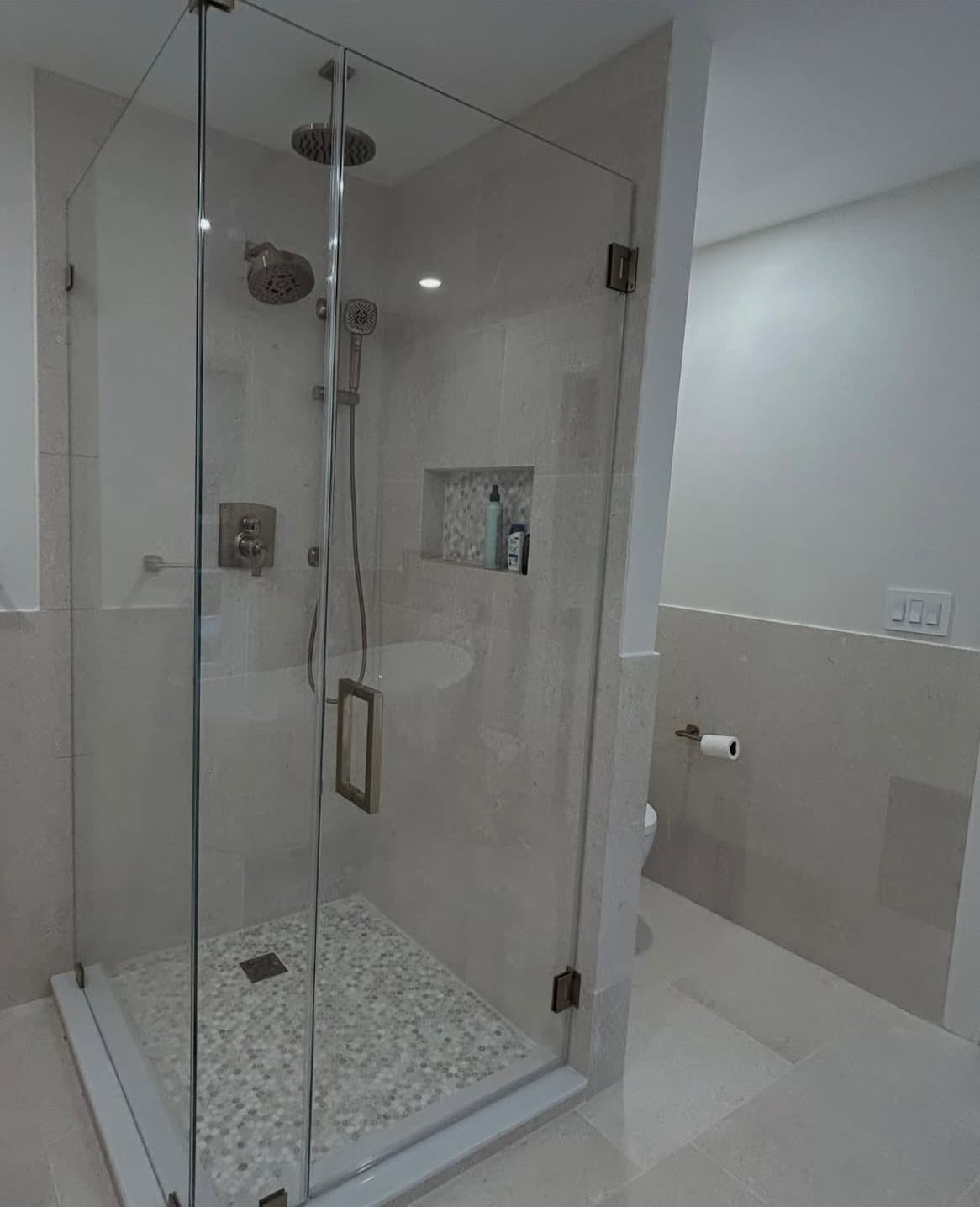 Frameless glass shower with brushed gold hardware, Portsmouth NH project style