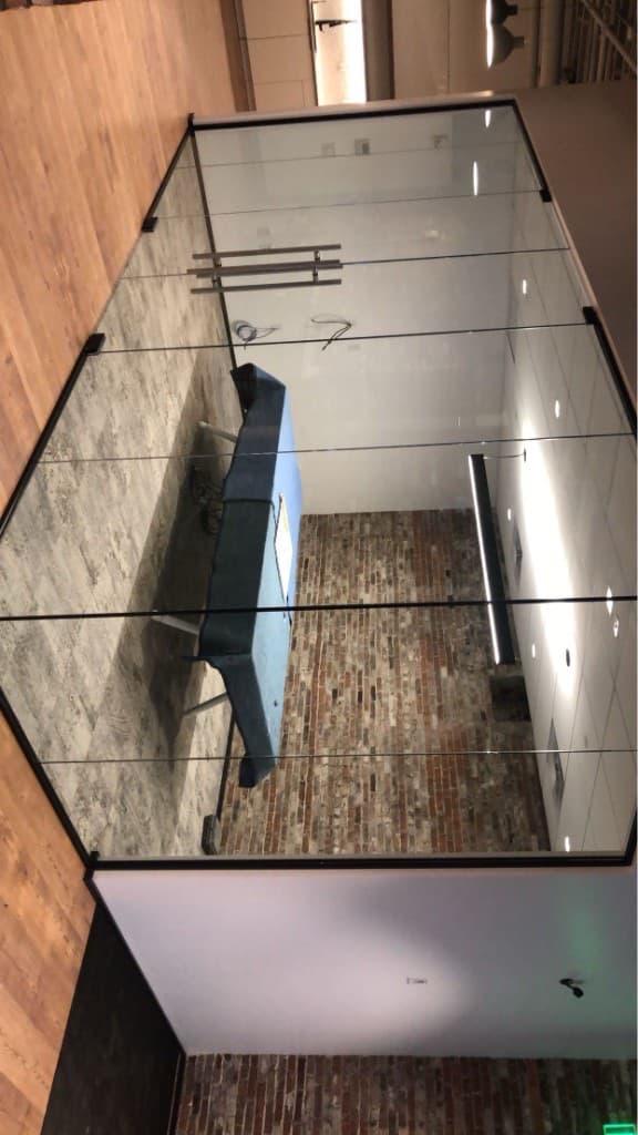 Commercial glass partition wall and doors with black framing